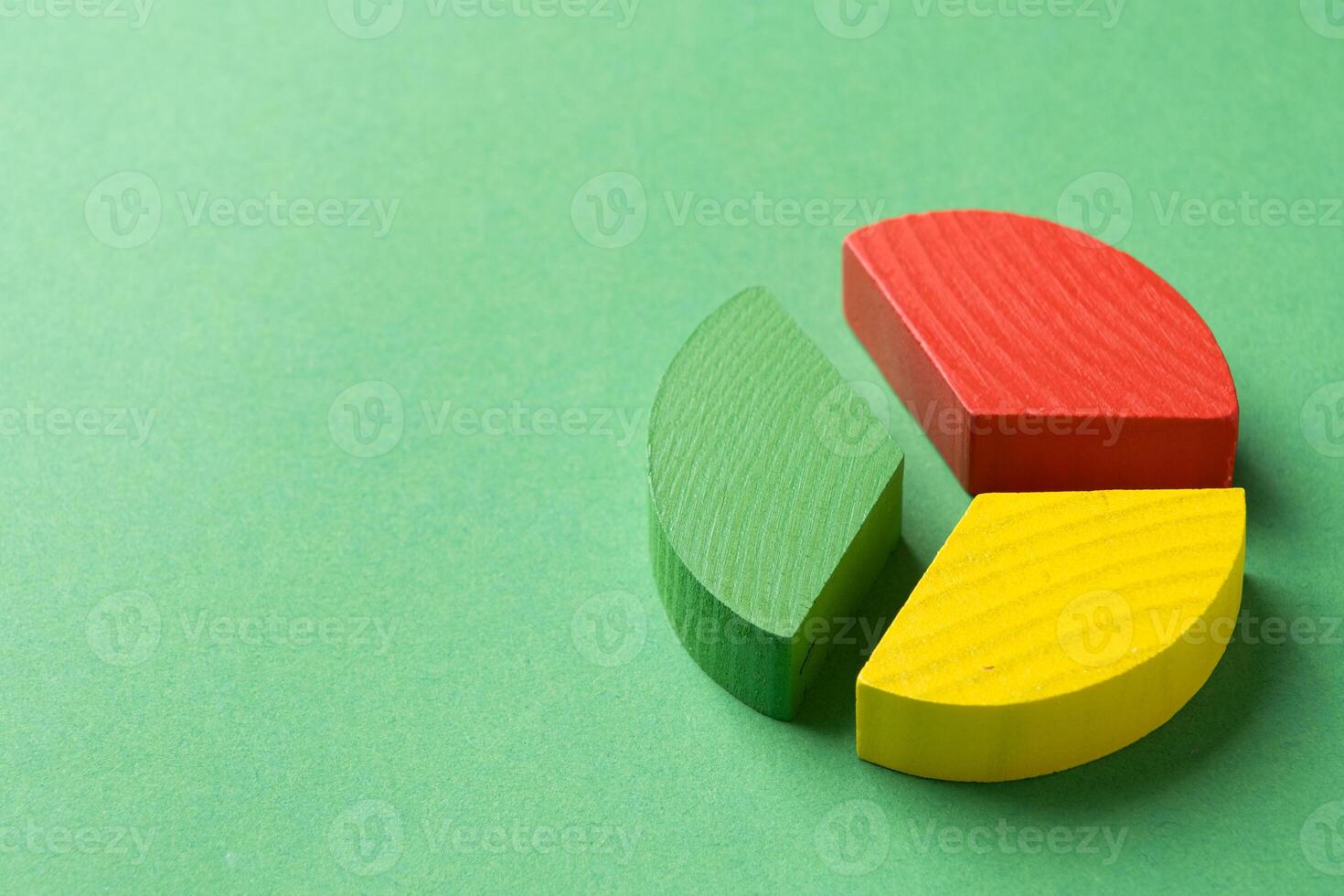 Colorful wooden pie chart pieces photo