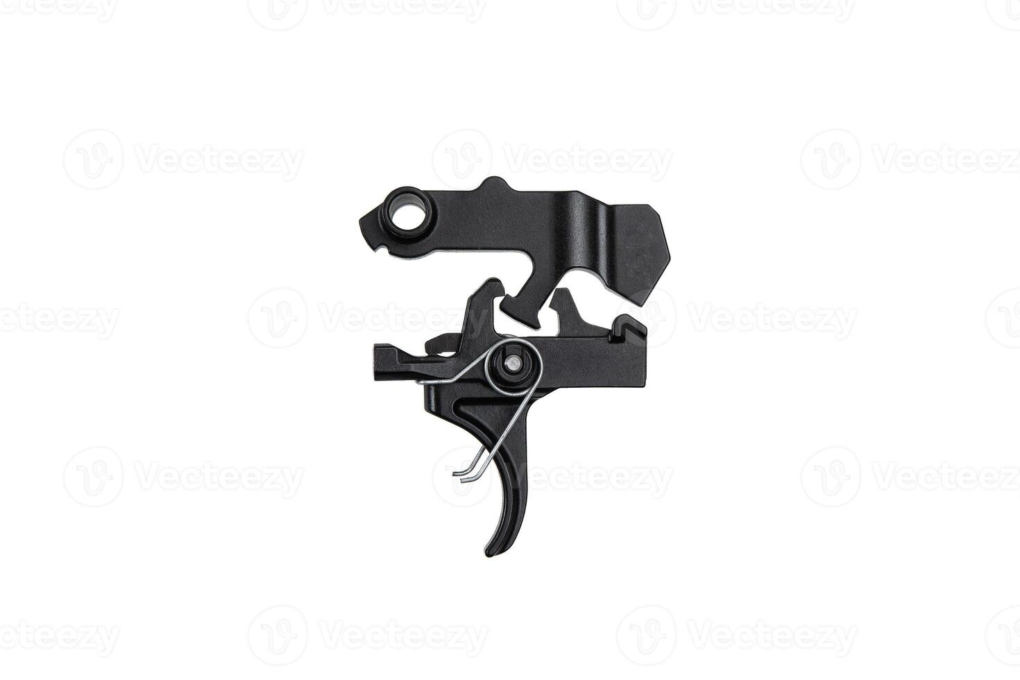 Shock trigger for gun isolate on white back. Gun trigger. Repair spare part. photo