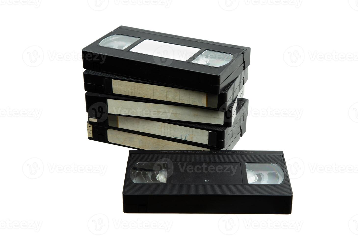 Pile of VHS video cassettes. Vintage media. Isolate on a white back. photo