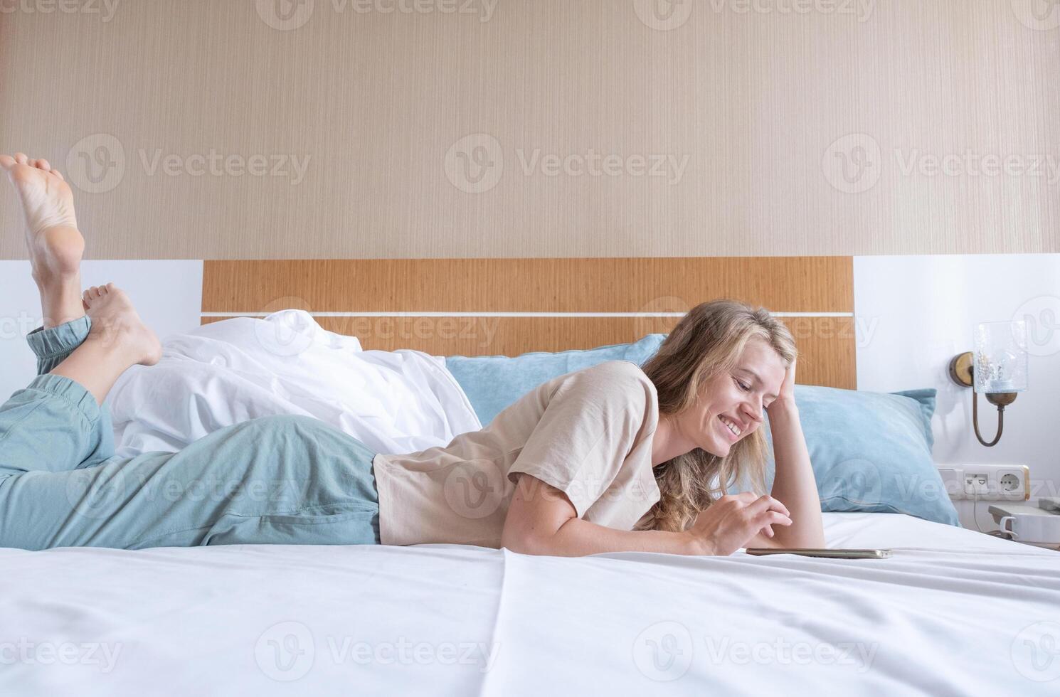Woman lying in bed after wake up 38586225 Stock Photo at Vecteezy