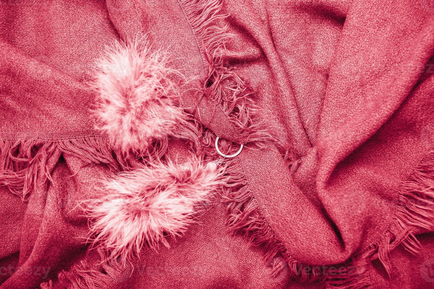 bright magenta scarf with fringe,natural background,fashion accessory for autumn photo
