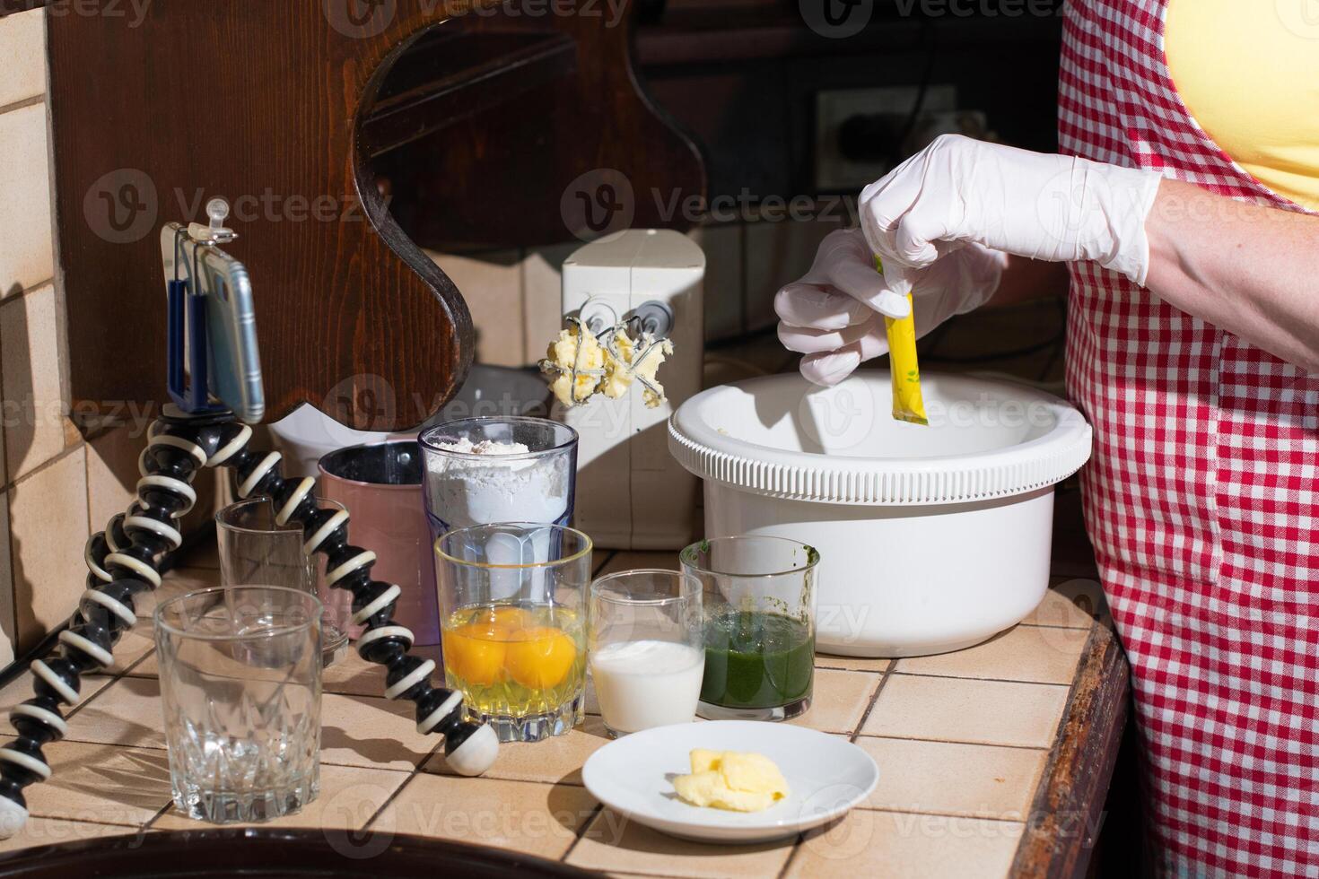 woman cooking spinach muffin step by step,adding vanillin to the dough photo