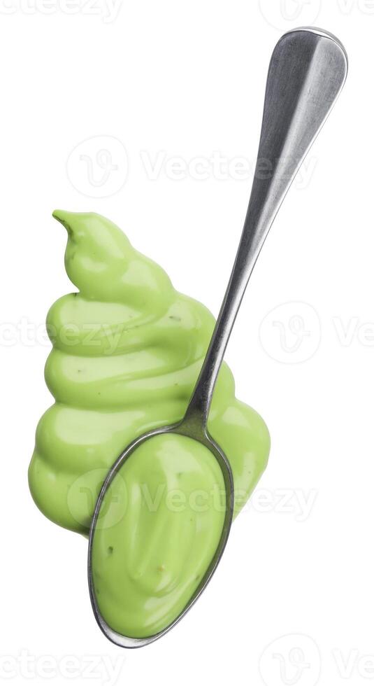 Garlic sauce isolated on white background, top view, spoon of green mayonnaise sauce photo
