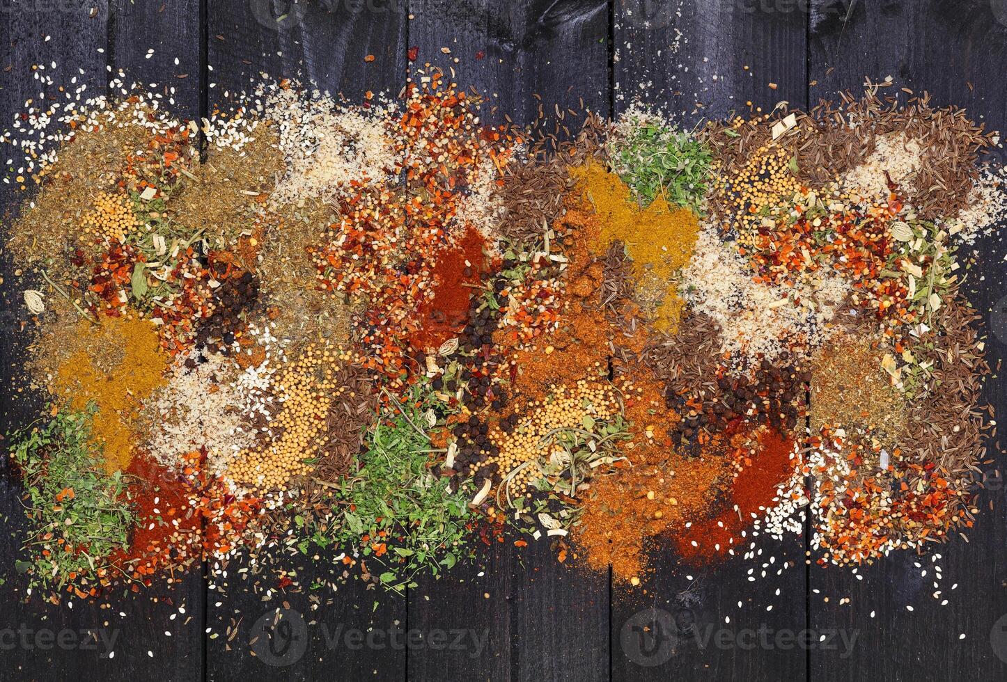 Various spices on wooden background. Top view with copy space photo