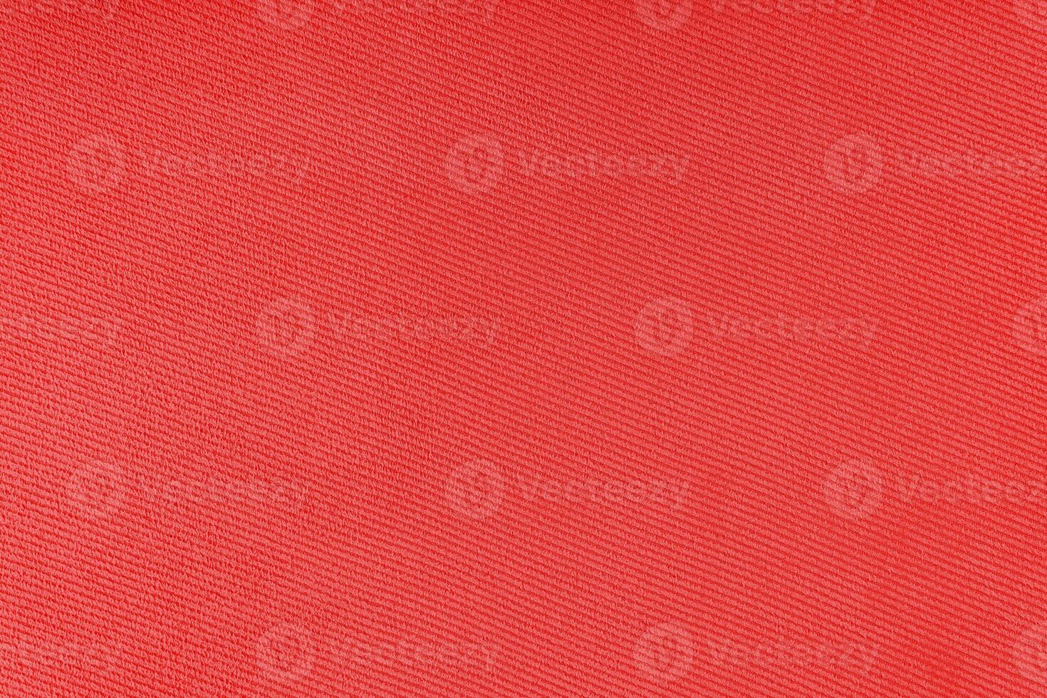 Texture of red fabric diagonal weave pattern. Decorative textile background photo