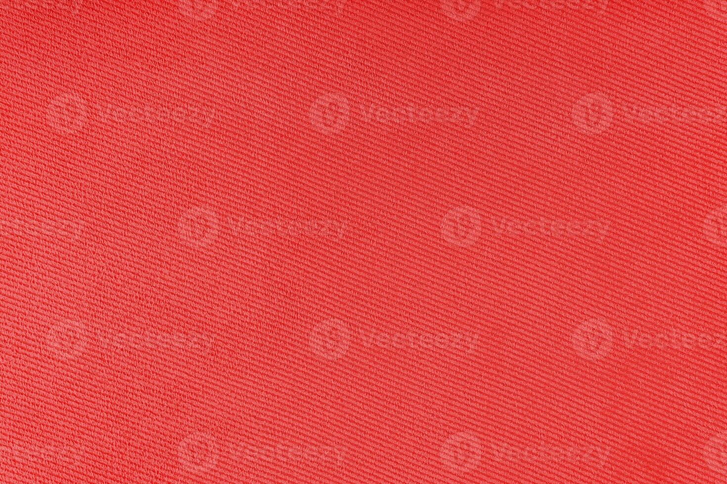 Texture of red fabric diagonal weave pattern. Decorative textile background photo