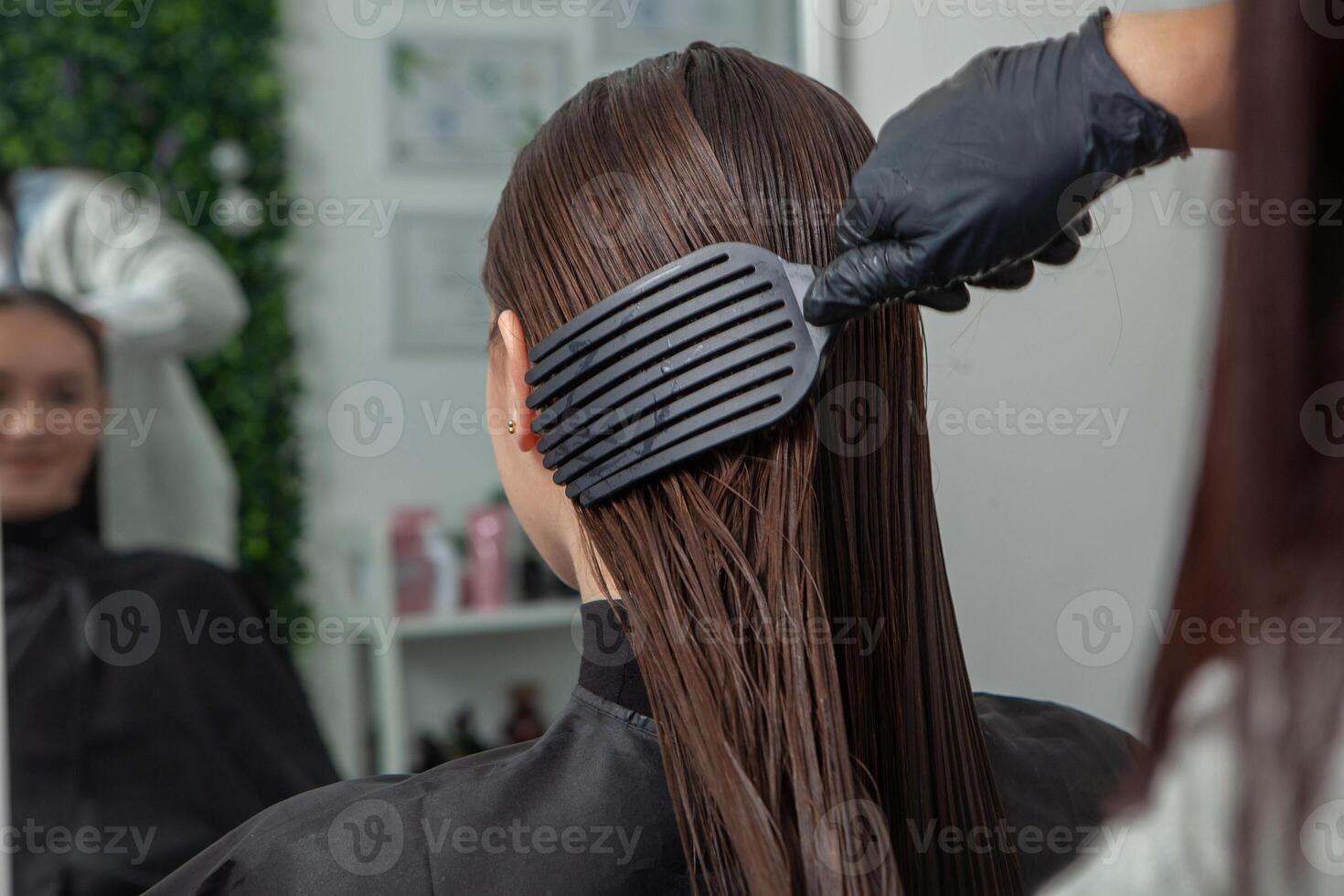 Portrait of a beautiful woman with long brown straight hair in a beauty salon. photo