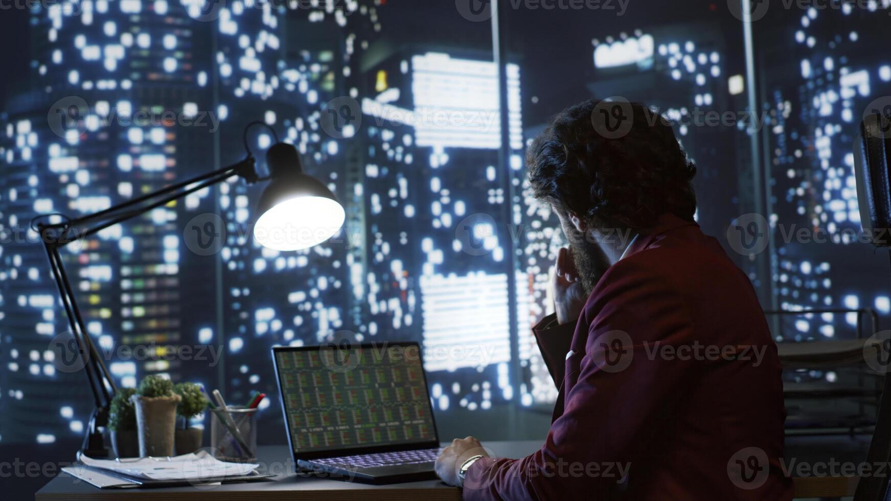 Skilled trader researching global economic conditions for the purpose of trading investments in finance, boost multinational legal earnings. Analyst working at nighttime to provide required capital. photo