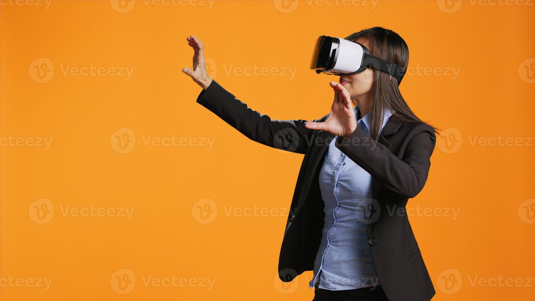 Company worker using virtual reality glasses in studio, enjoying metaverse technology and artificial intelligence on new gadget. Young adult using vr headset for modern visual simulation. photo