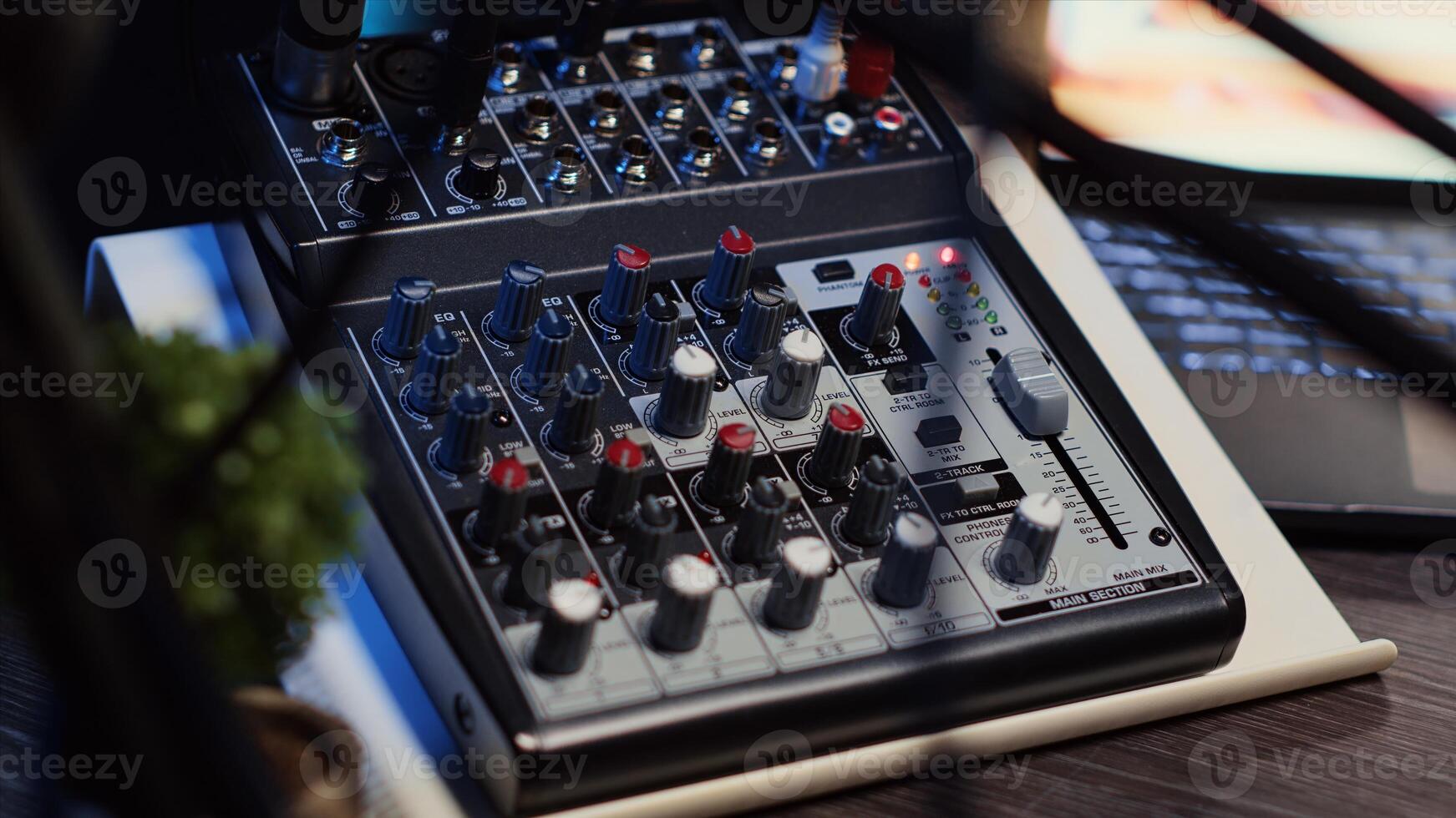 Close up shot of professional analog mixer with mixing channels, onboard effects and quality microphone able to produce impeccable sound during podcast recording in dimly lit studio photo