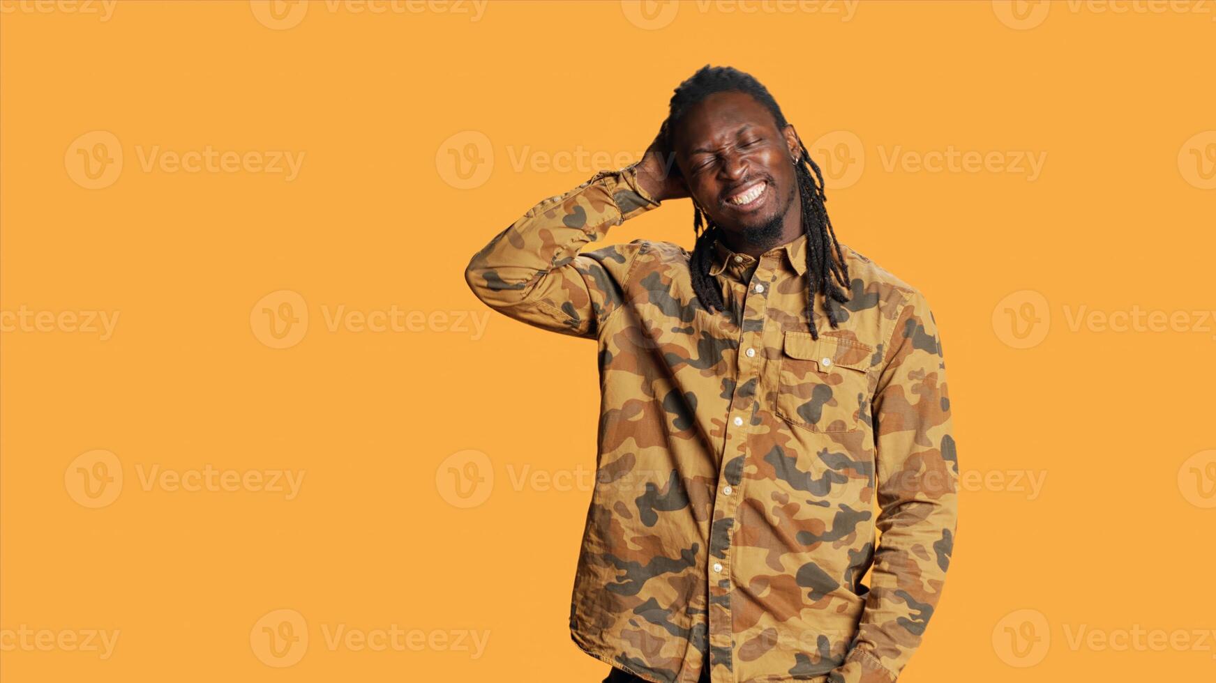 African american focused man acting confused and clueless, posing with doubt and feeling unsure in studio. Young person being contemplative and reflective, expressing uncertainty. photo