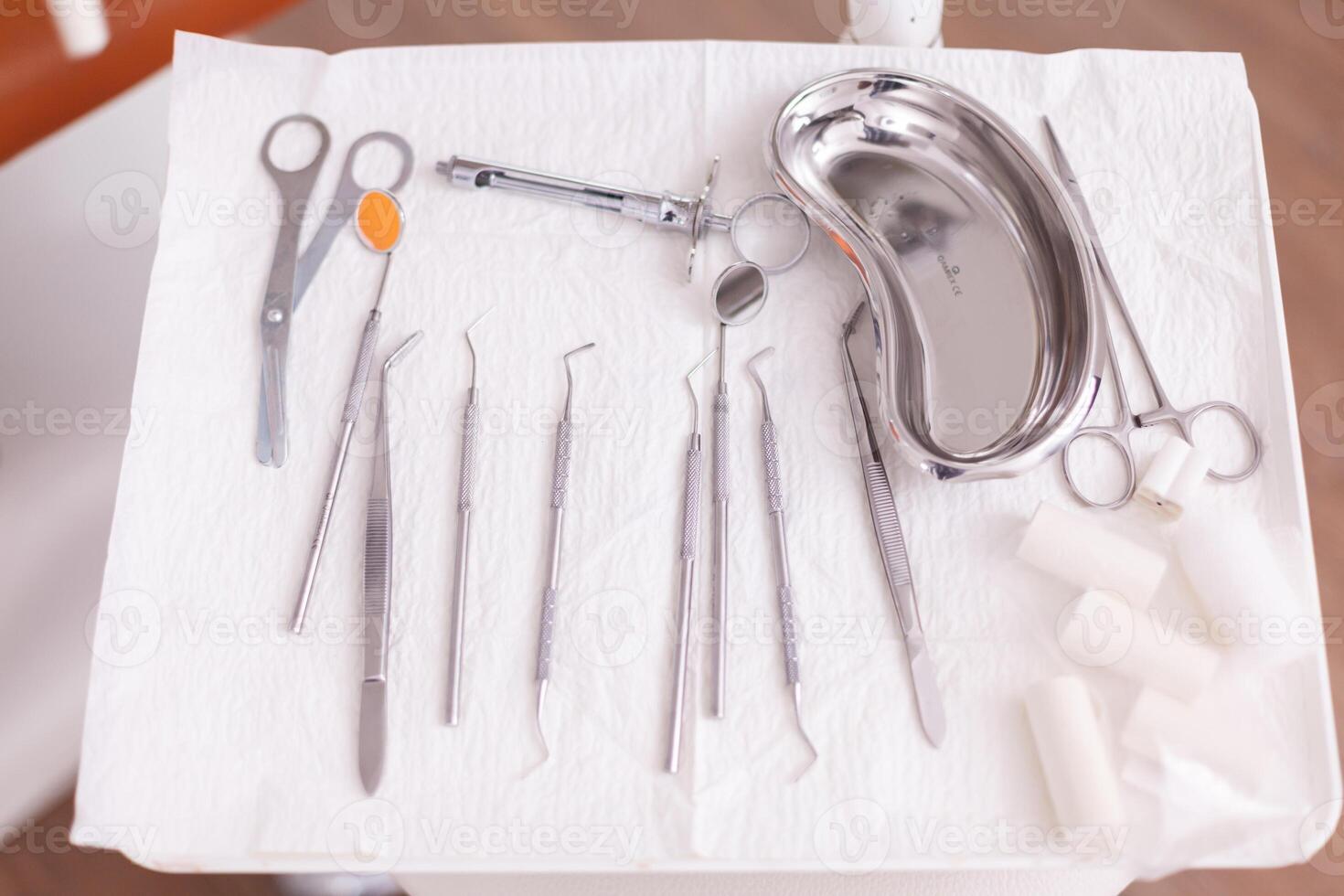 Professional dental stomatology teeth tools standing on modern equipment in orthodontic hospital office room. Workplace cabinet for hygiene tooth , dentistry treatment clinic photo
