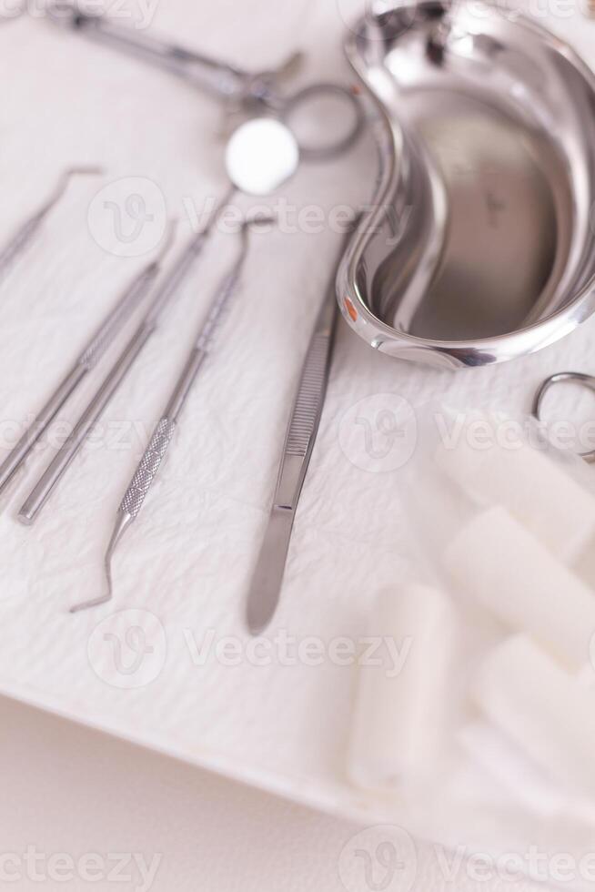 Close up of oral dental instruments ready for dentistry teeth surgery in stomatology hospital room. Modern office equipped with professional medical tooth tools ready for dental healthcare photo