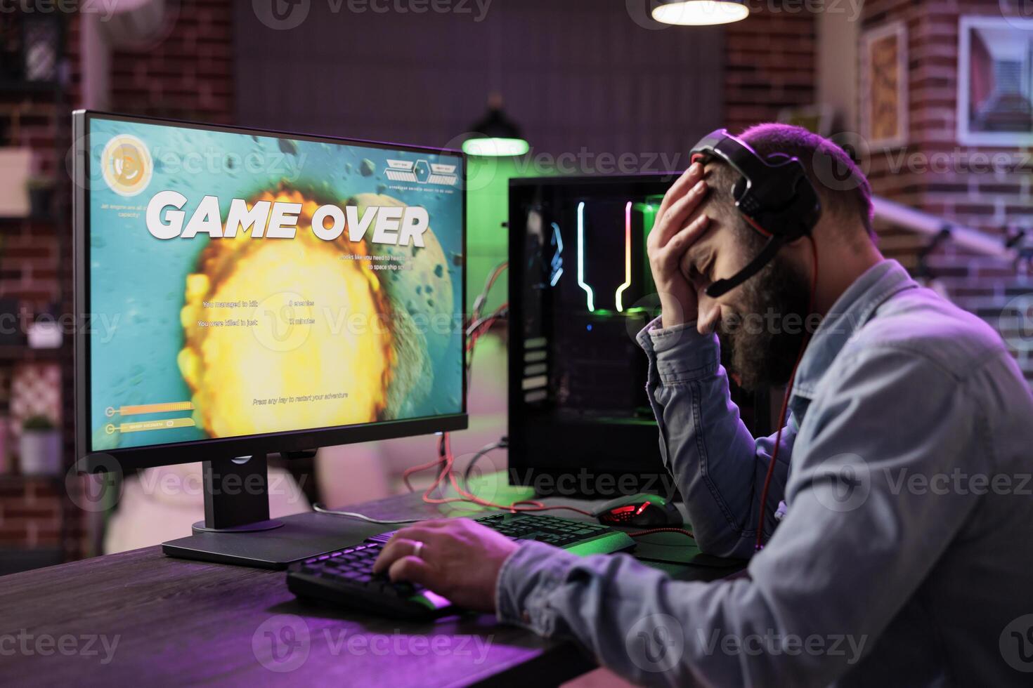 Gamer feeling depressed after losing online multiplayer action videogame match, being outsmarted by rival players. Dejected man getting headache from frustration after seeing game over screen photo