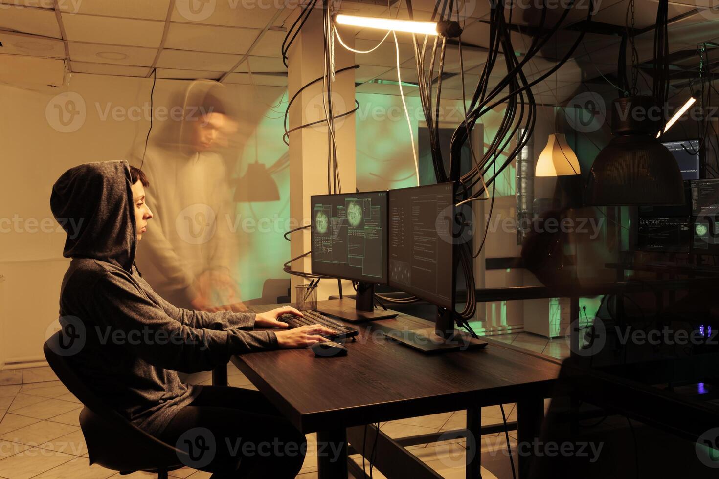 Female spy hacking network server to steal passwords, causing computer malware to access important database. Person working on identity theft, asking for ransomware late at night. photo