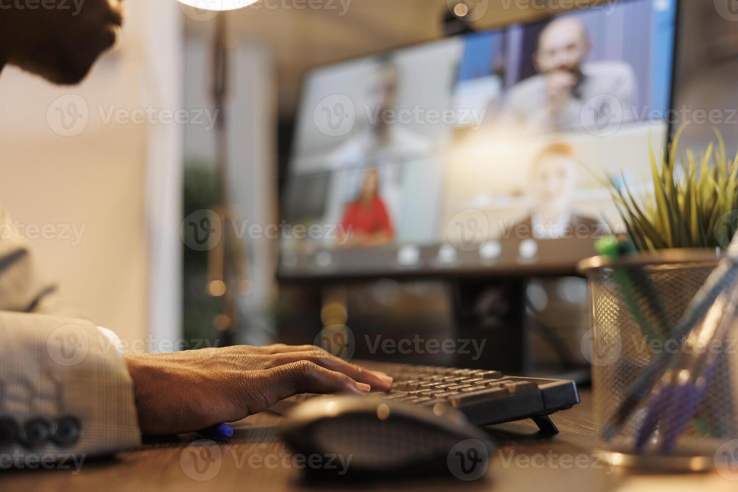Entrepreneur discussing marketing statistics with remote coworkers during online videocall meeting conference. Diverse colleagues working over hours at company strategy in startup office photo