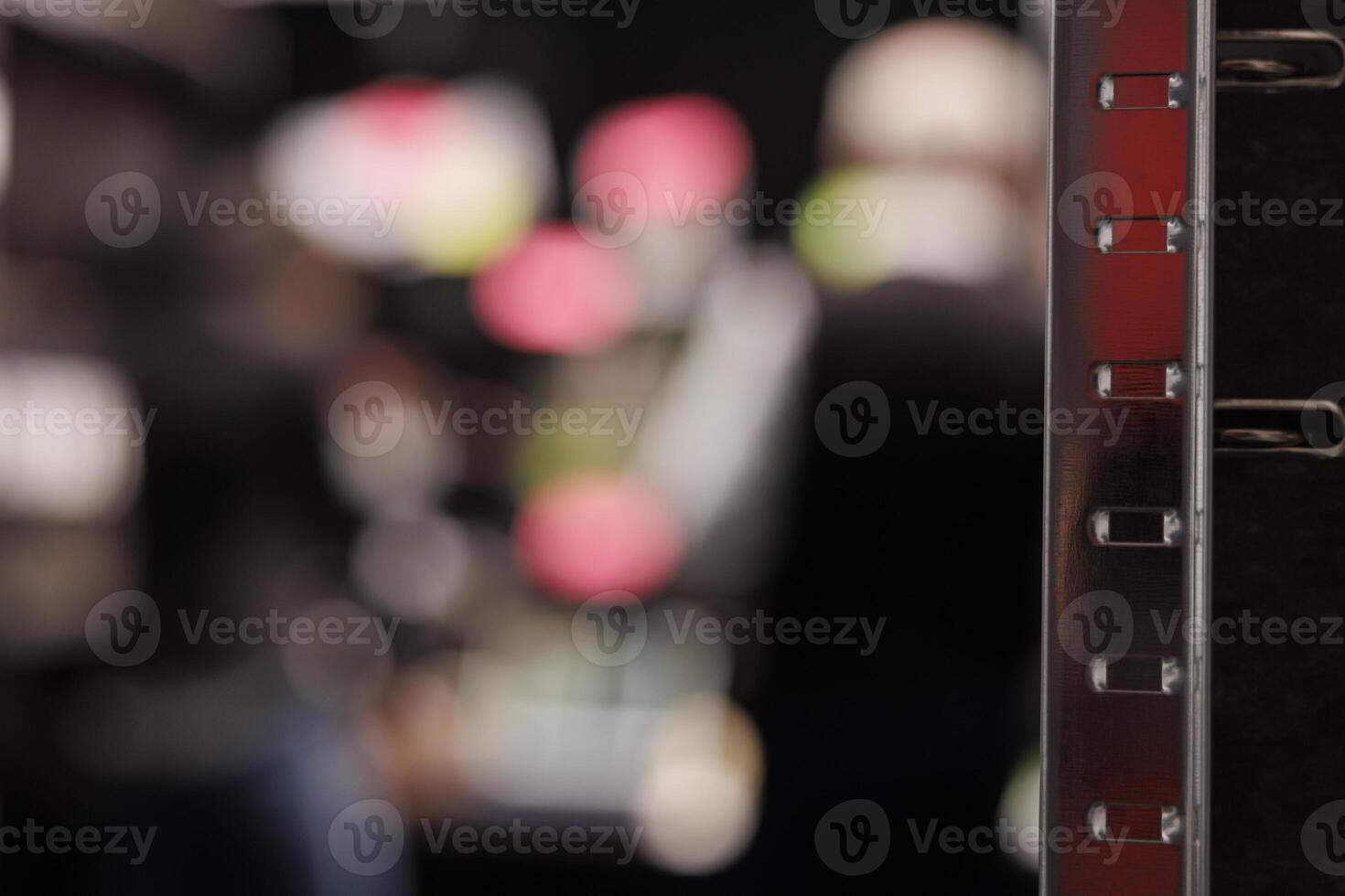 Selective focus of dark room equipped with metallic storage full with federal documents. In background private detectives working overhours at criminal case, analyzing crime scene evidence photo