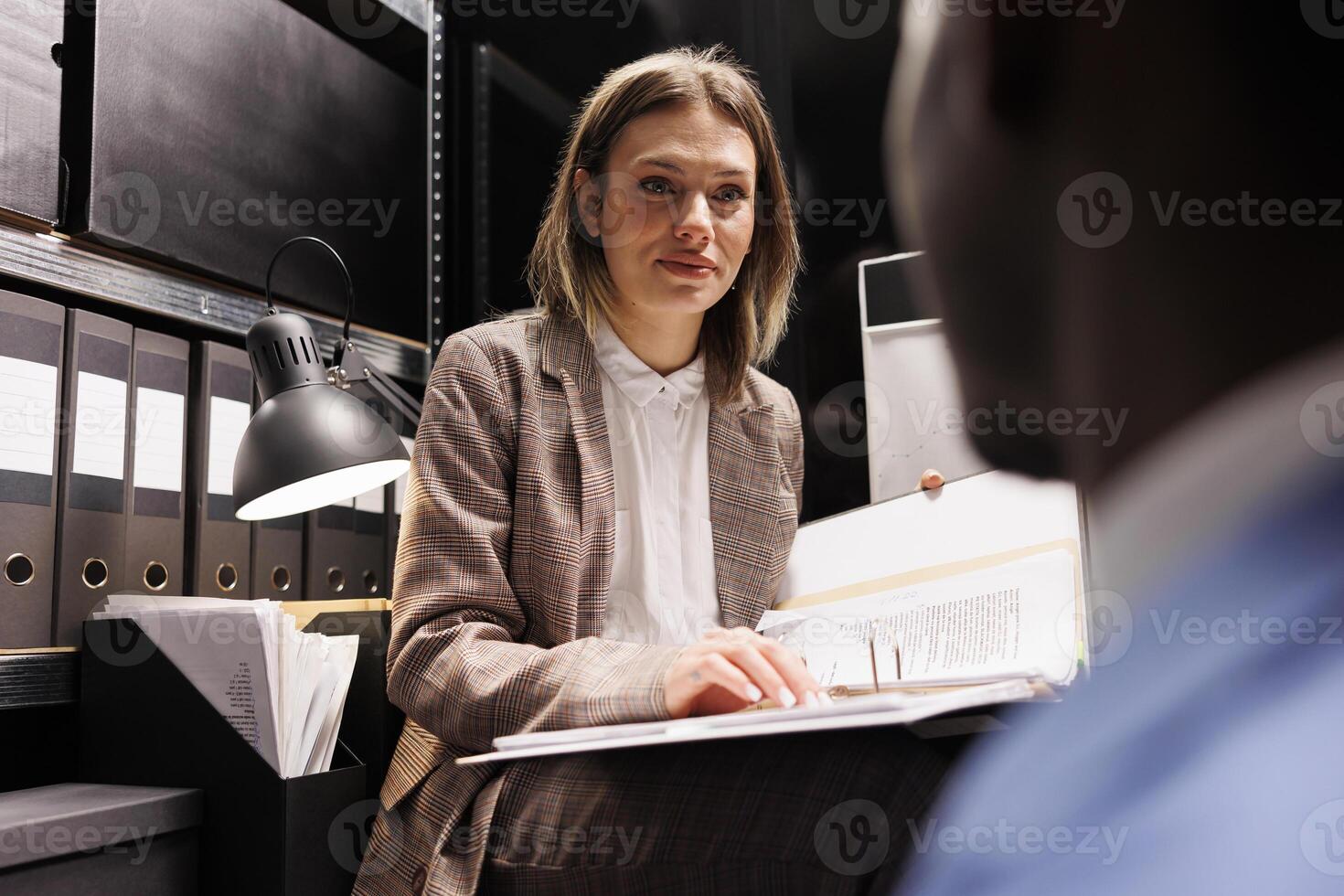 Managers organizing at business files, analyzing bureaucracy record in storage room. Diverse businesspeople discussing accountancy report, checking administrative documents in corporate depository photo