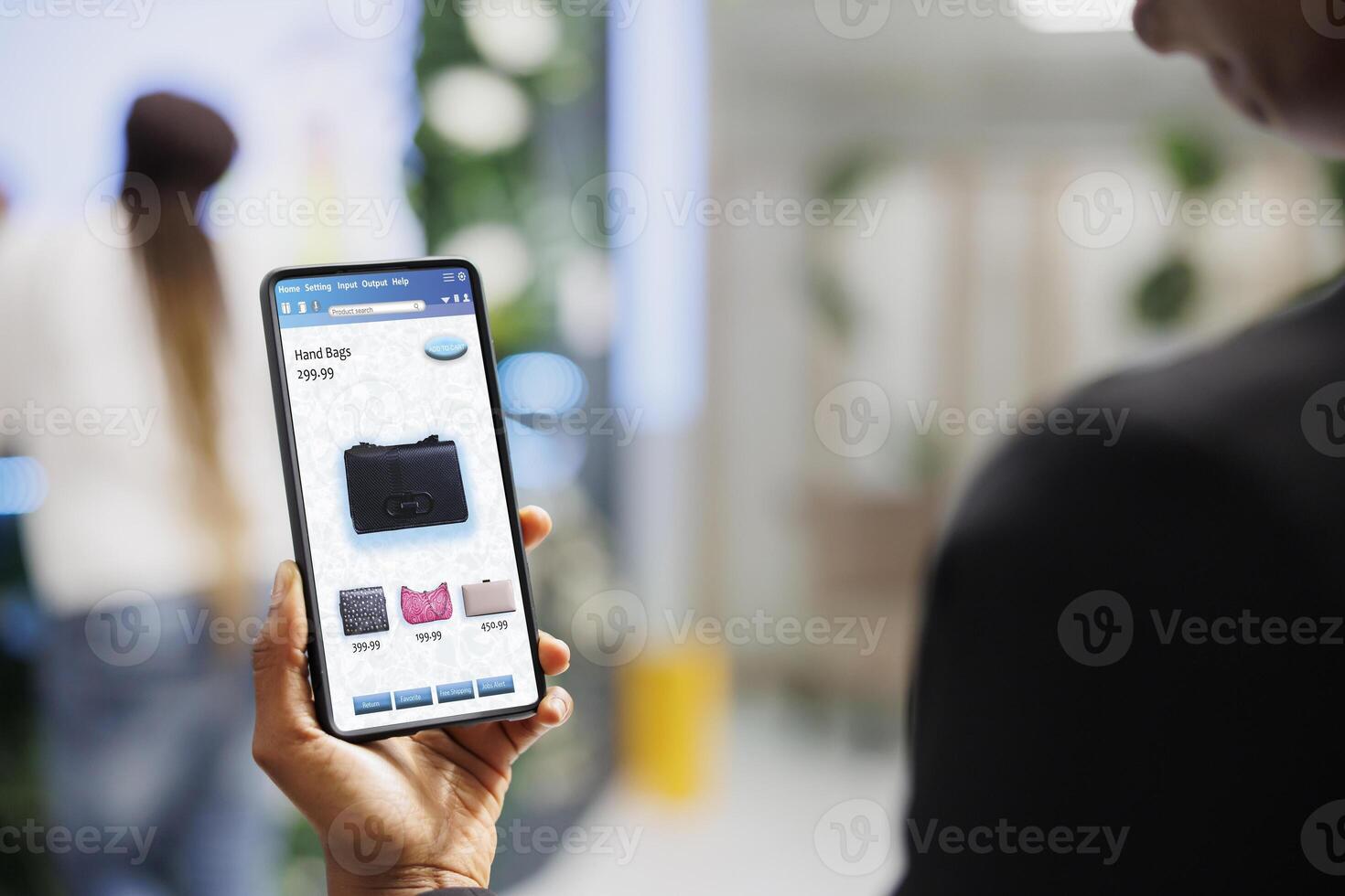 Client choosing clothes on online app, looking at modern fashion collection on mobile application. Young shopper choosing clothing items on clothes boutique website in retail shop. photo