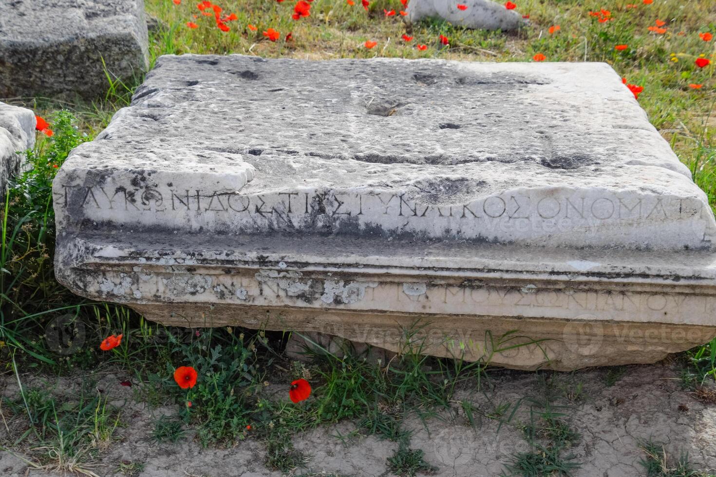 Fragments of ancient buildings, ruins of the ancient city of Hierapolis. Stone blocks with traces of stone machining. photo