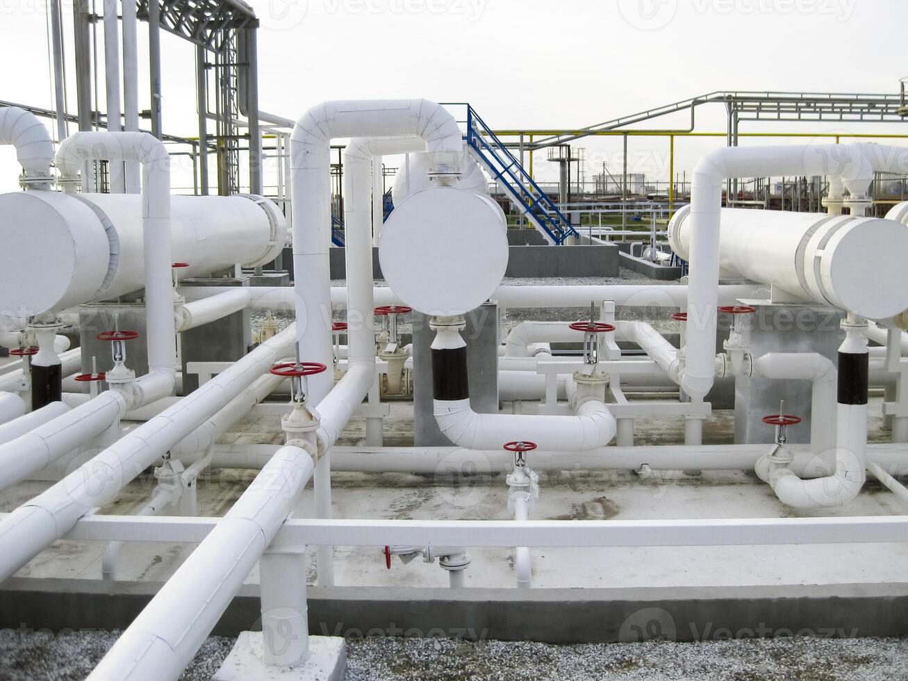 Heat exchangers in a refinery. The equipment for oil refining photo