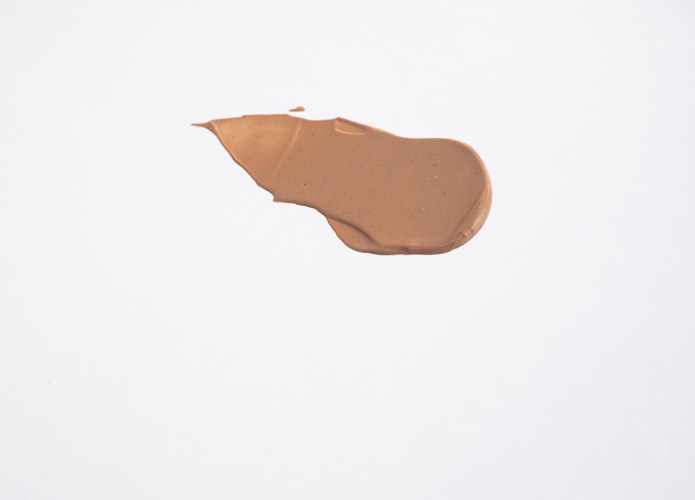 close-up smear of foundation, red clay masks on a white background photo