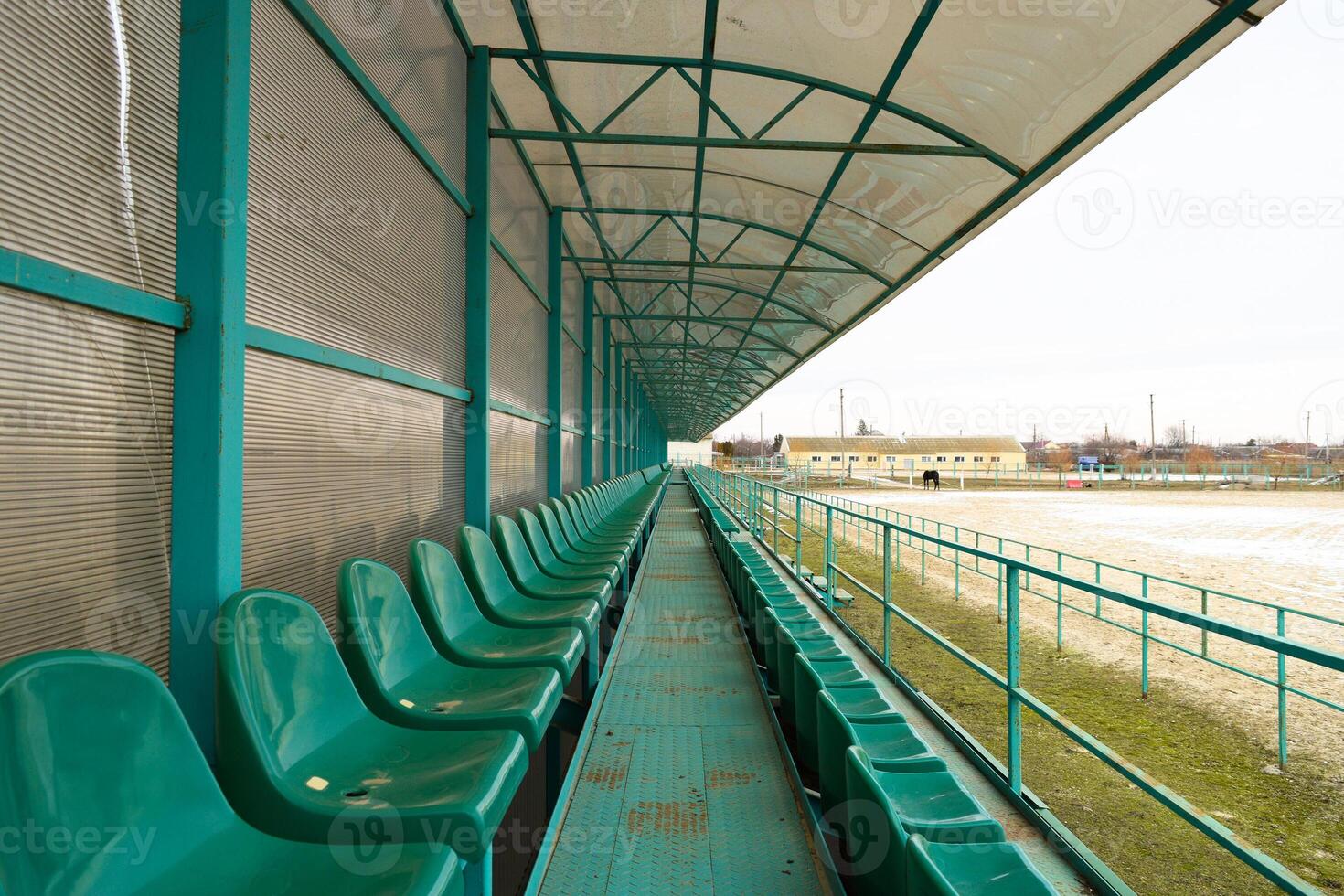 Rows of seats in an empty stadium. Green seats at the stadium photo
