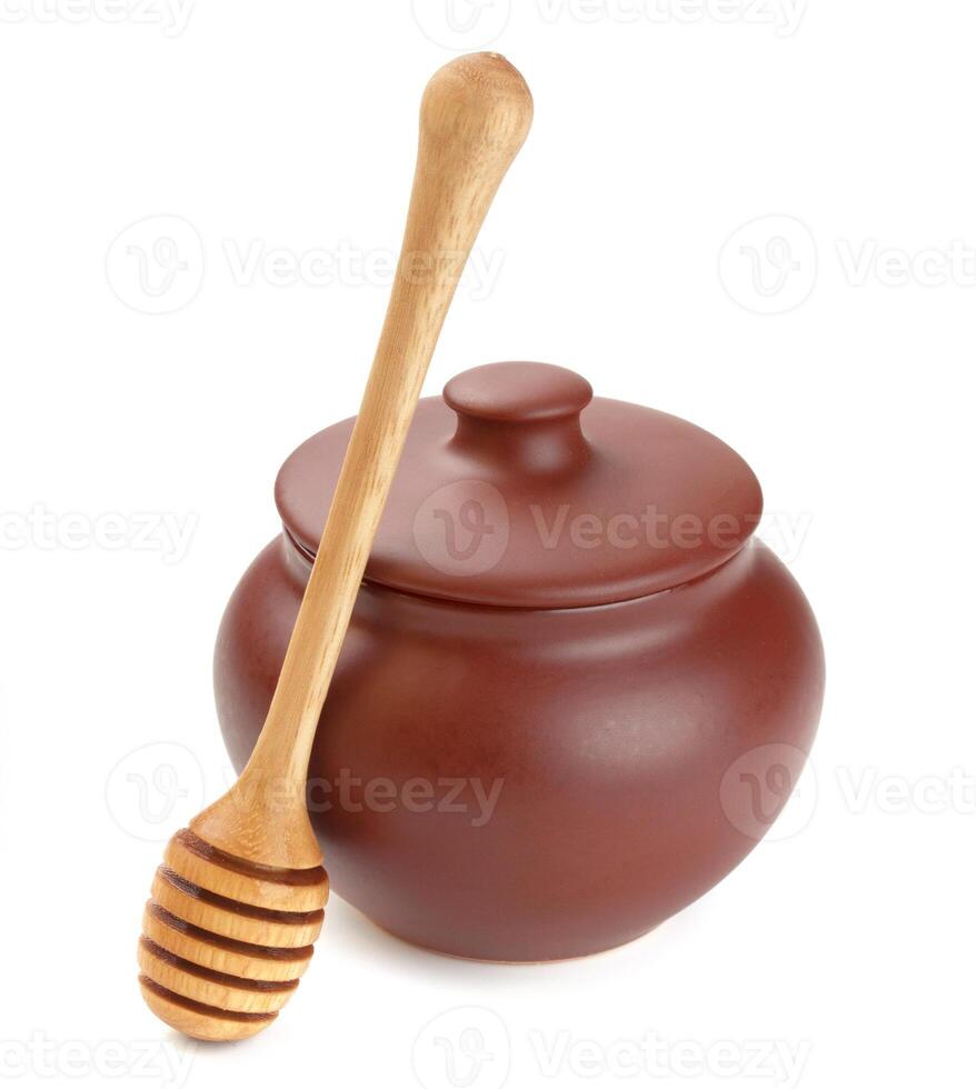 Honey pot isolated on white background photo