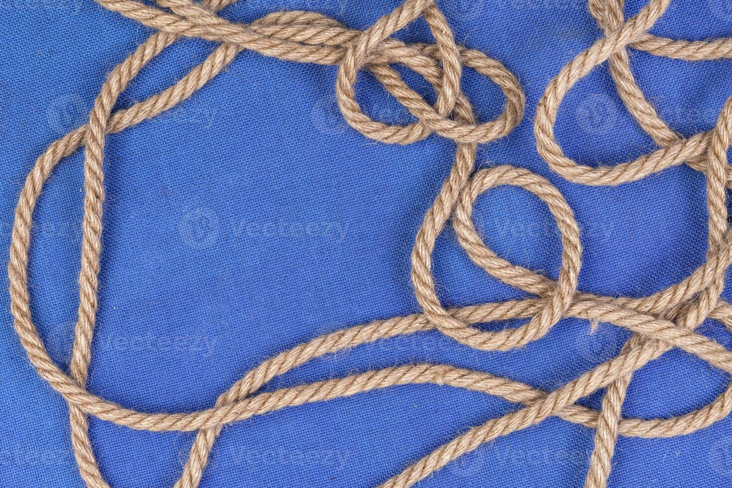 Ship rope on blue background, top view with copy space photo