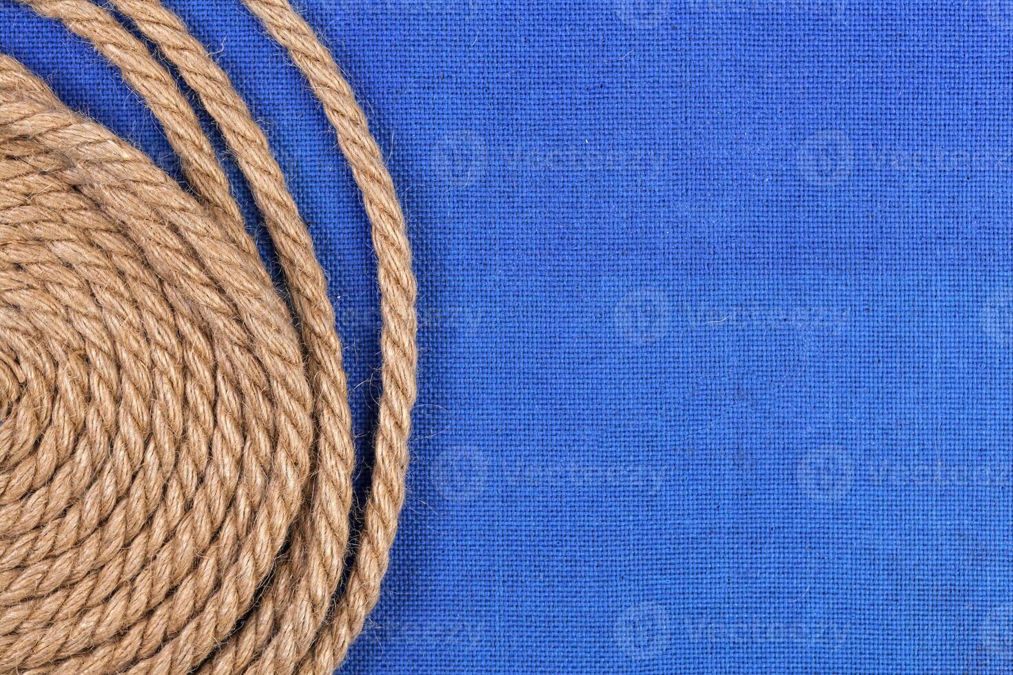 Ship rope on blue background, top view with copy space photo