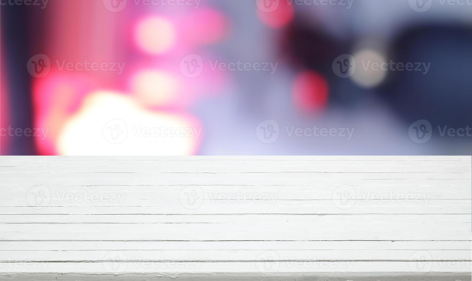 White wooden table for product presentation with colorful bokeh photo