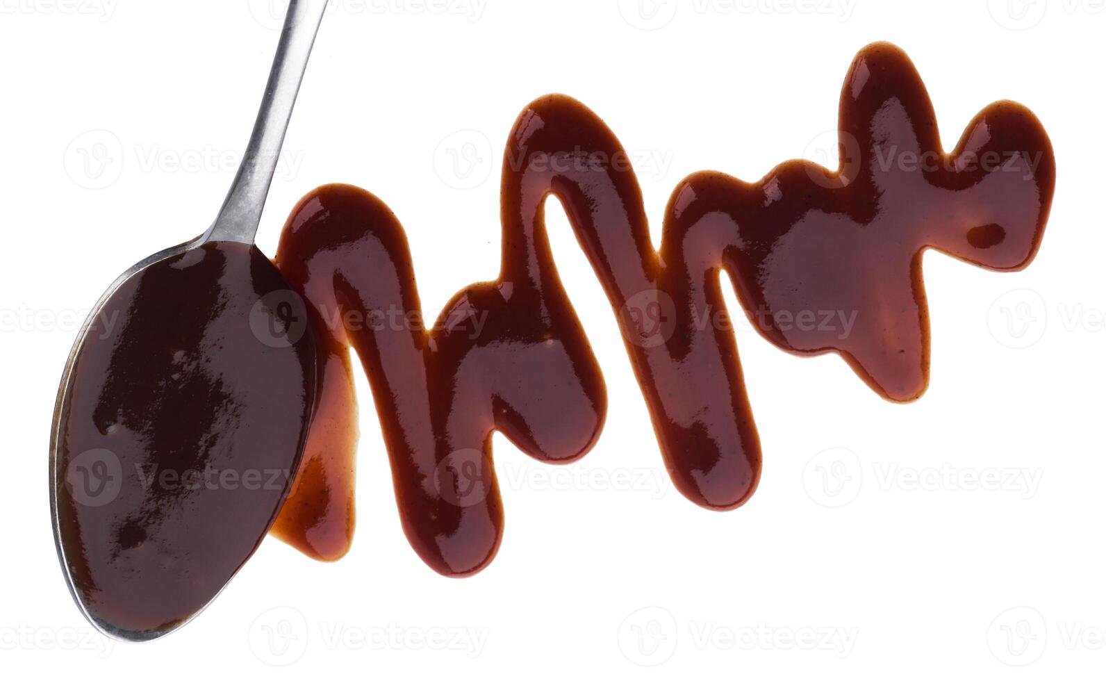 Barbecue sauce with spoon isolated on white background. Top view photo