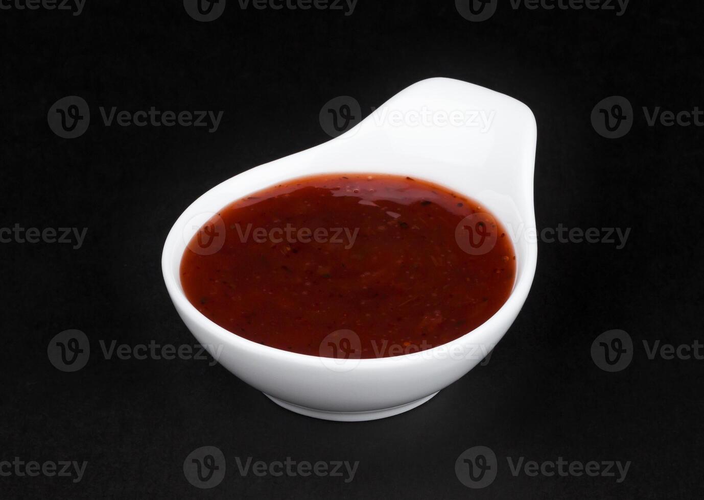 Cranberry sauce in white bowl isolated photo