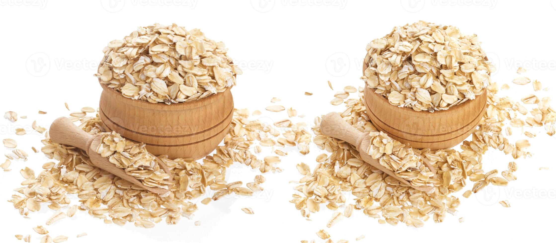 Oat flakes in wooden bowl isolated on white background photo