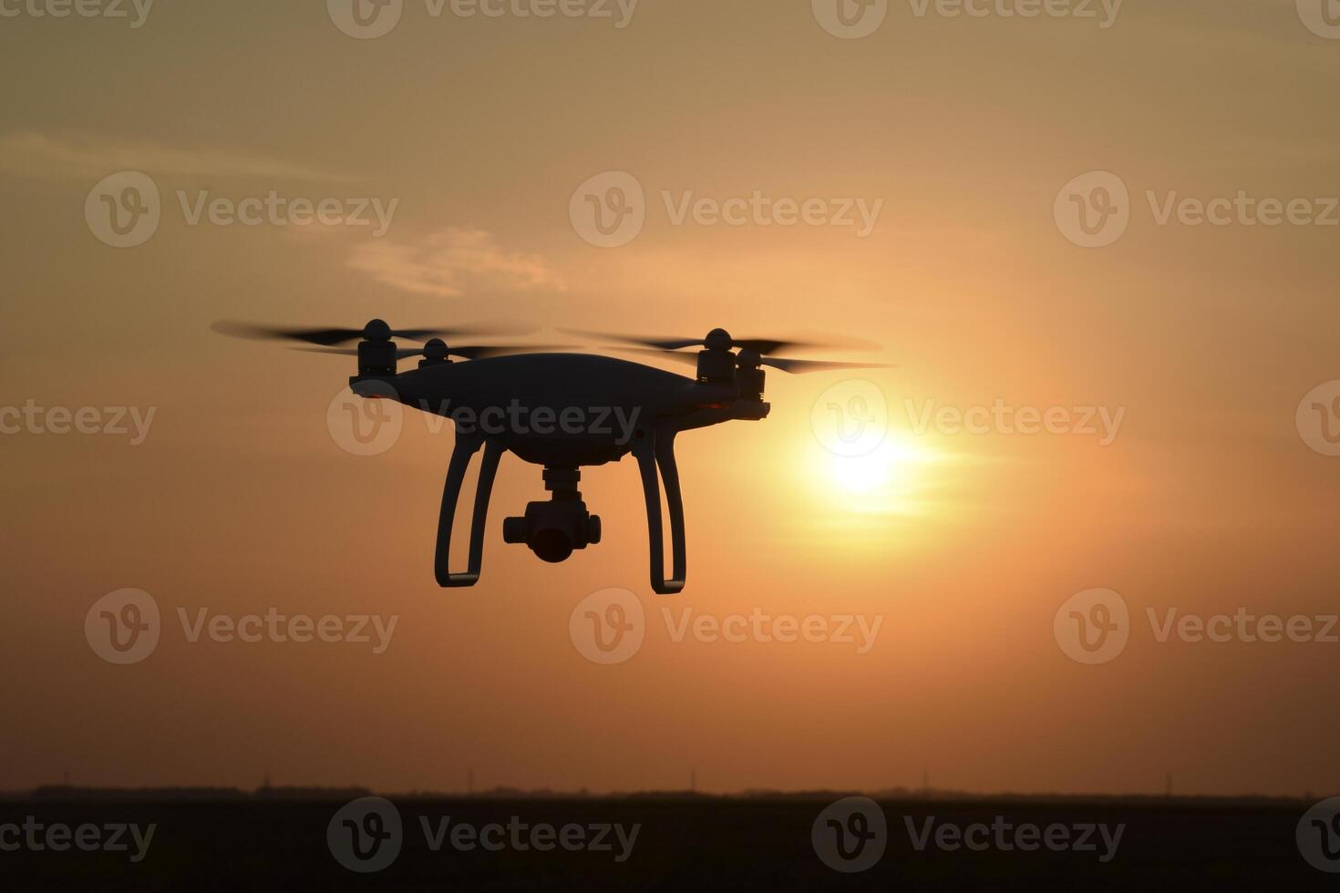 drone silhouette against the background of the sunset photo