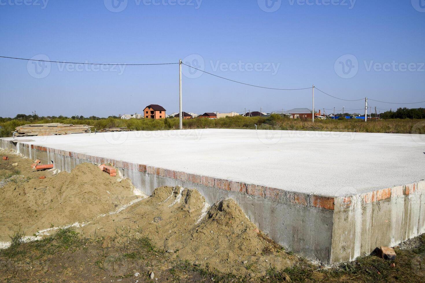 Filled foundation of the house and floors. Home construction. photo