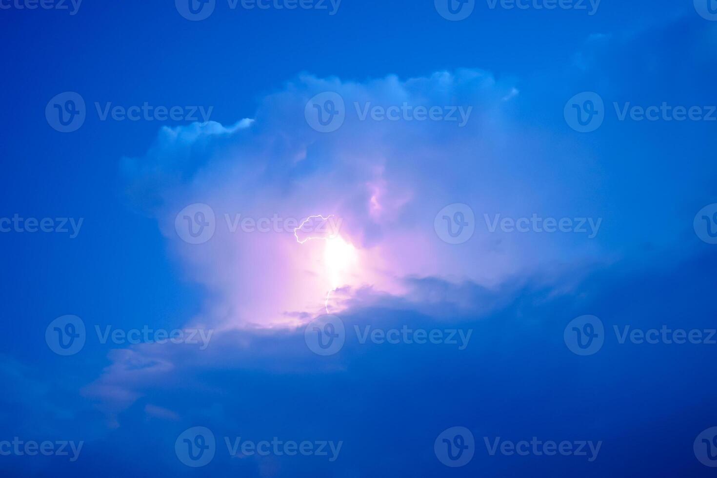 Lightnings in storm clouds. Peals of a thunder and the sparkling lightnings in clouds photo