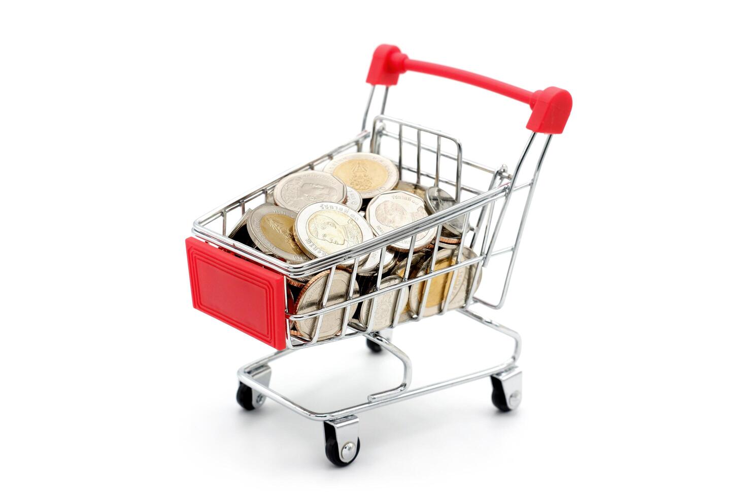 New Thai Baht coins in red miniature shopping cart. Business and finance concept. photo
