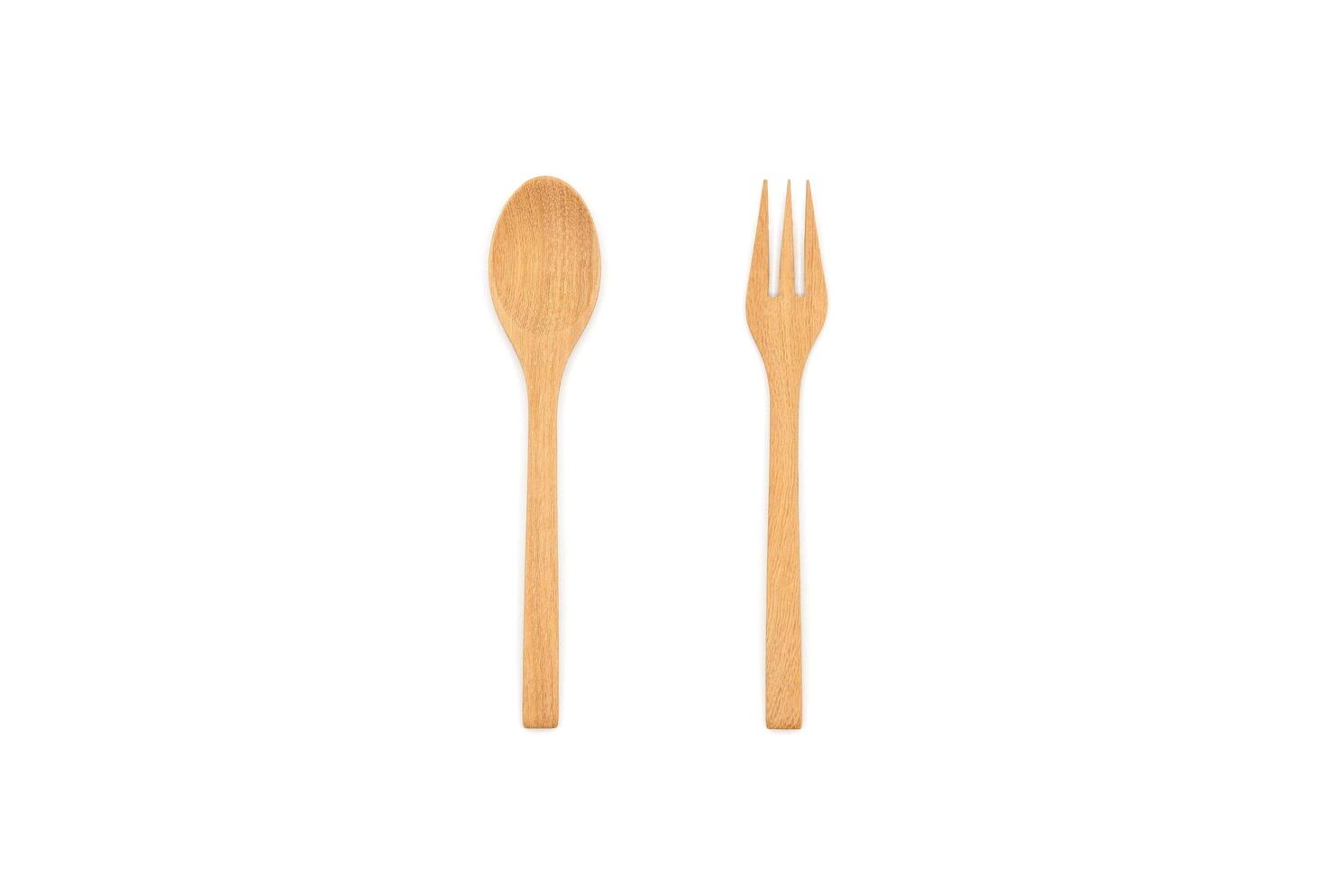 Wooden spoon and fork, isolated on white background. Top view image. photo