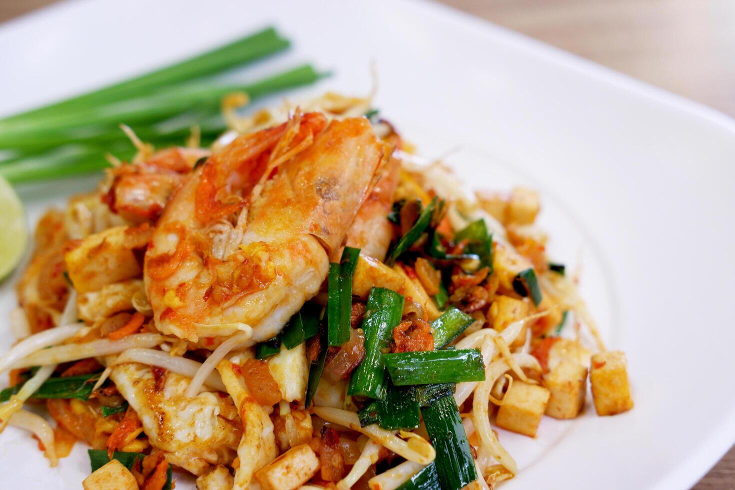 Pad Thai, Stir-fried noodle with shrimp, tofu, bean sprouts and vegetables. Famous Thai street food. photo