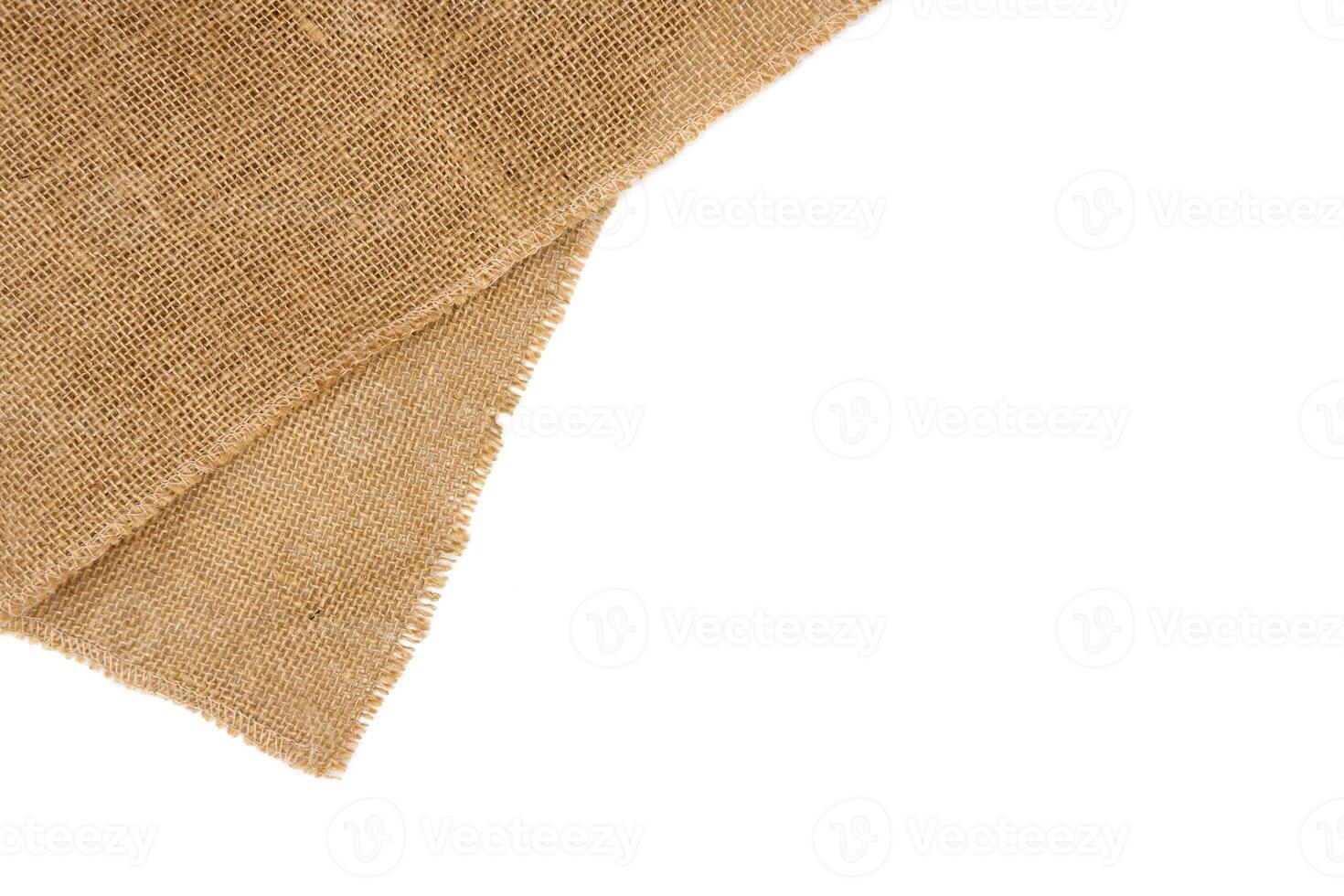 Rustic brown burlap cloth, isolated on white background. photo