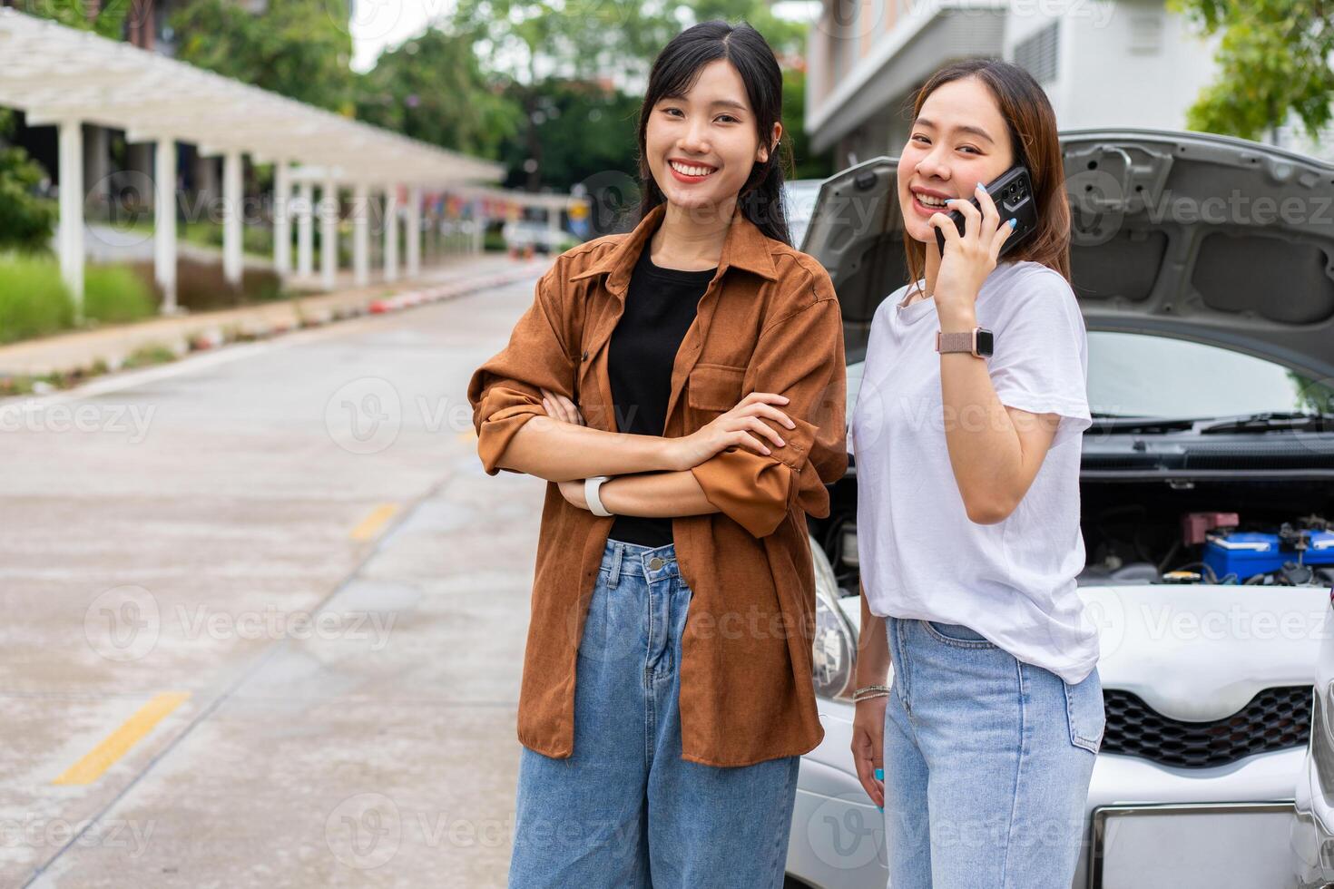 Two Drivers using a smartphone to exchange phone numbers and social media after a car accident. Concept of claim insurance for a car accident online after send photo and evidence to insurance company