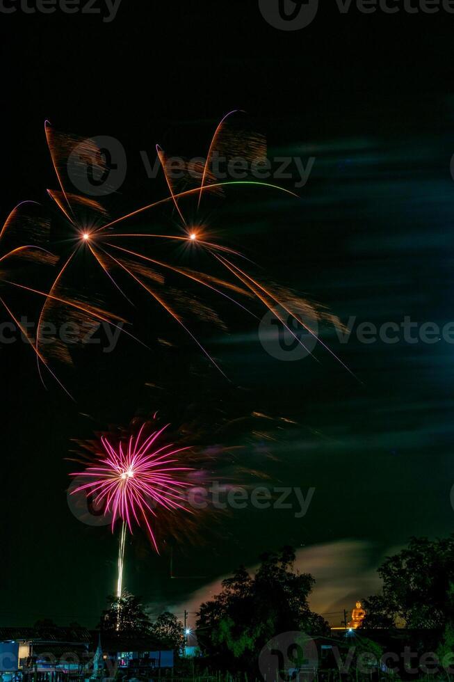 fireworks on the river in the dark sky photo