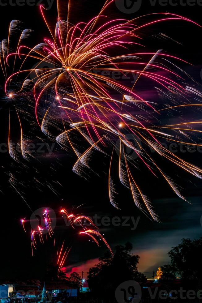 fireworks on the river in the dark sky photo