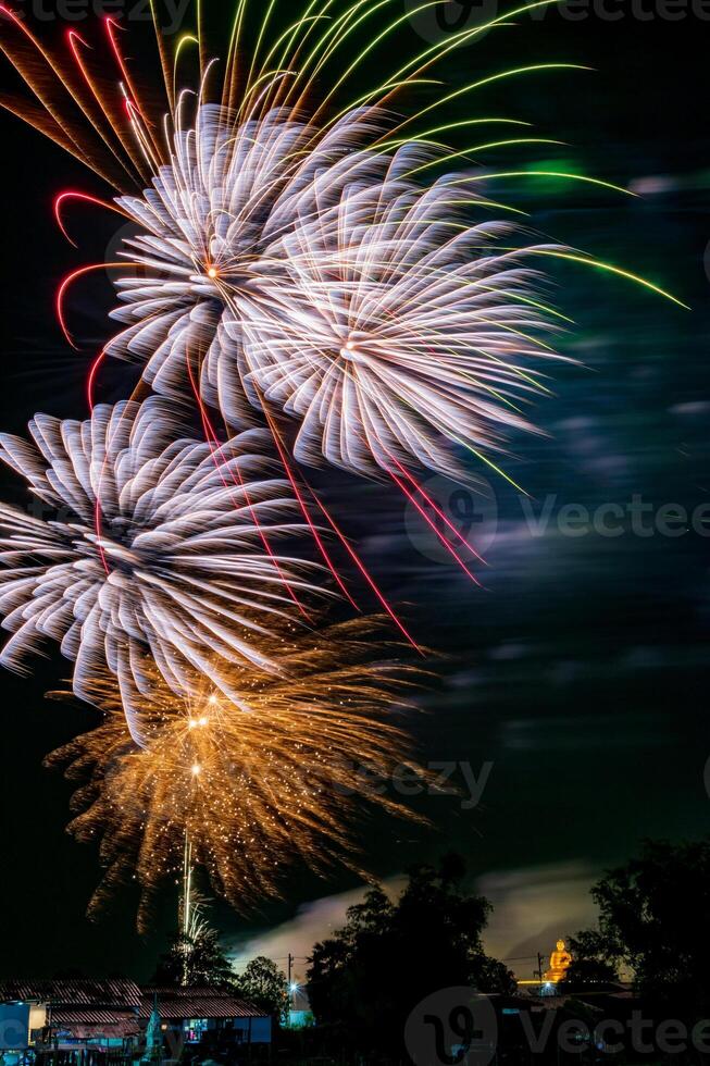 fireworks on the river in the dark sky photo
