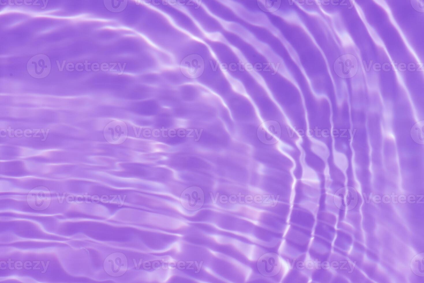 Water surface. Bluewater waves on the surface ripples blurred. Defocus blurred transparent blue colored clear calm water surface texture with splash and bubbles. Water waves with shining pattern. photo