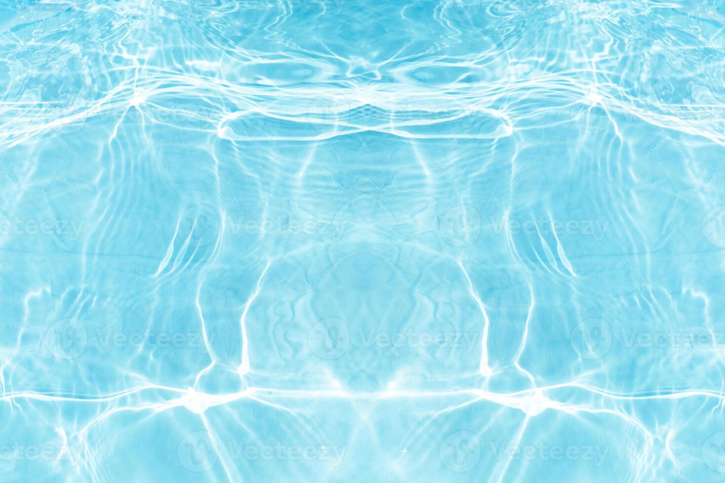 Bluewater waves on the surface ripples blurred. Defocus blurred transparent blue colored clear calm water surface texture with splash and bubbles. Water waves with shining pattern texture background. photo
