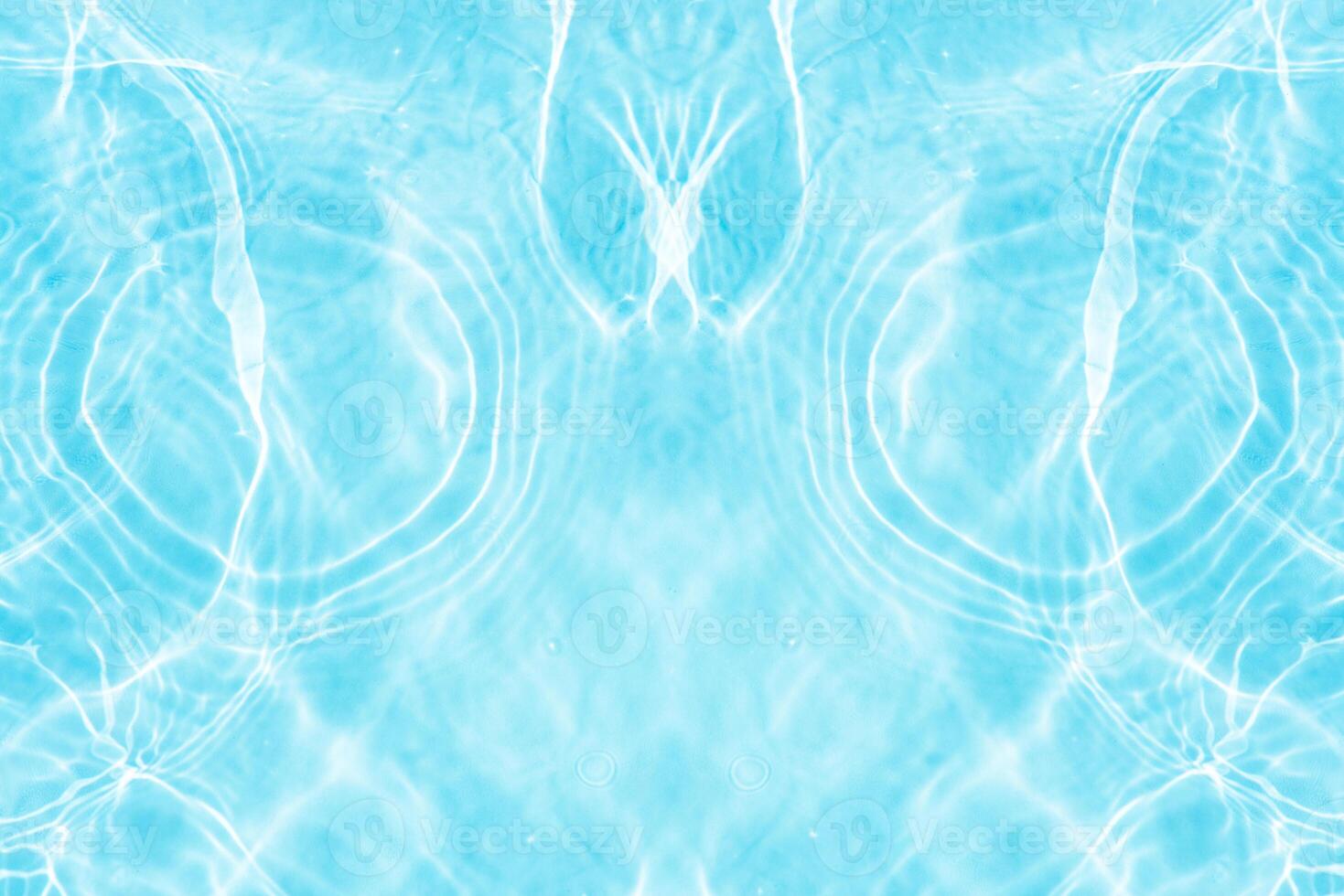 Bluewater waves on the surface ripples blurred. Defocus blurred transparent blue colored clear calm water surface texture with splash and bubbles. Water waves with shining pattern texture background. photo