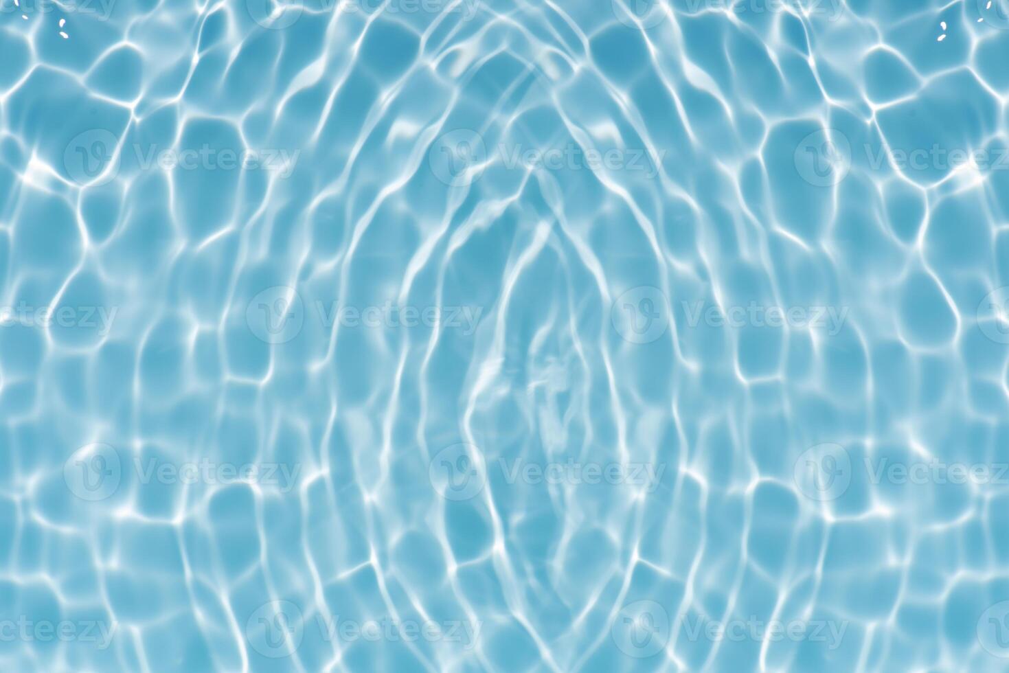 Bluewater waves on the surface ripples blurred. Defocus blurred transparent blue colored clear calm water surface texture with splash and bubbles. Water waves with shining pattern texture background. photo