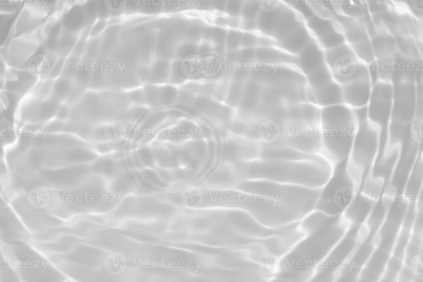 Water surface. Bluewater waves on the surface ripples blurred. Defocus blurred transparent blue colored clear calm water surface texture with splash and bubbles. Water waves with shining pattern. photo